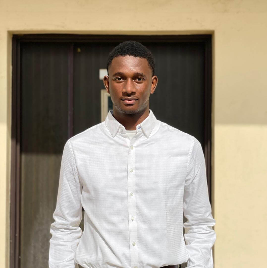 A picture of Ogundele Oluwatosin wearing a blue native attire