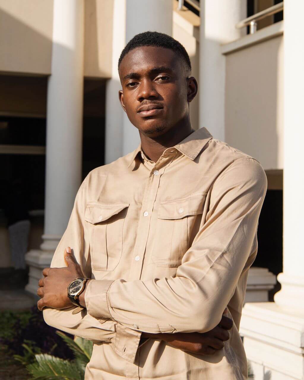 A picture of Ogundele Oluwatosin wearing a blue native attire